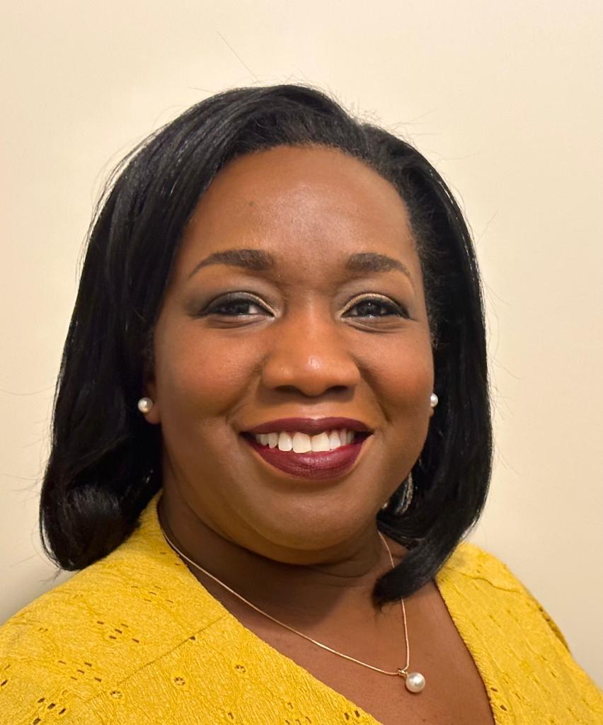 Janine Taylor smiles at the camera